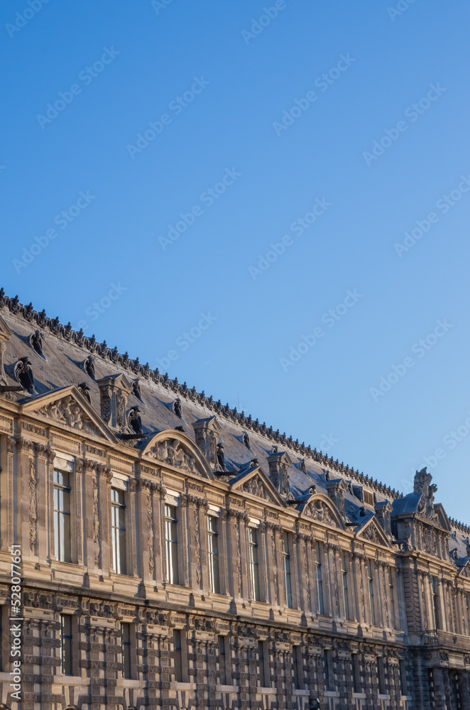 the facade of the classic european building in paris
