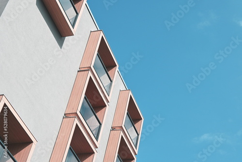 Geometric facade against clear sky