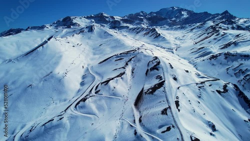 Santiago Chile. Ski station center at snowing Andes Mountains near Santiago Chile. Snow mountain landscape at winterness. Winter ness travel destination. Winter ness tourism travel. photo