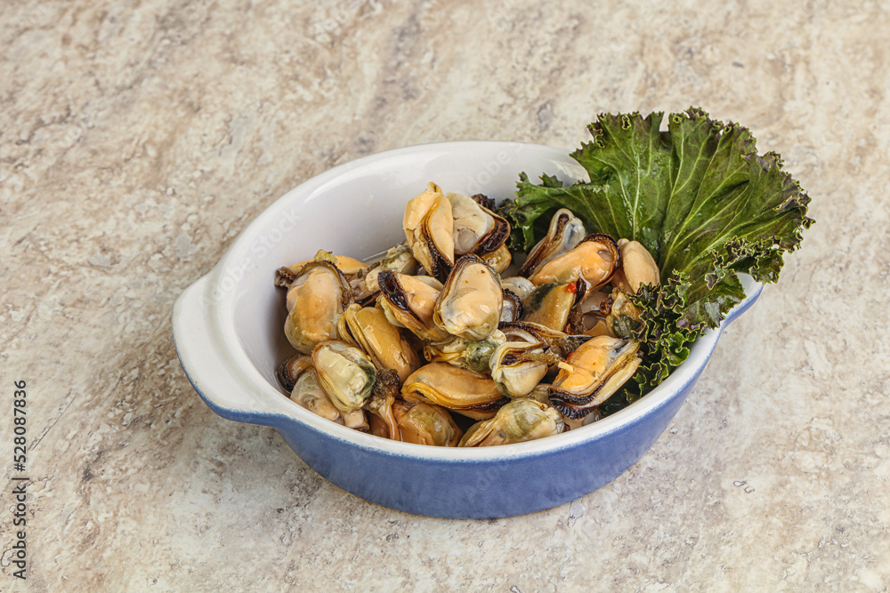 Tasty marinated mussels in the bowl Tasty marinated mussels in the bowl