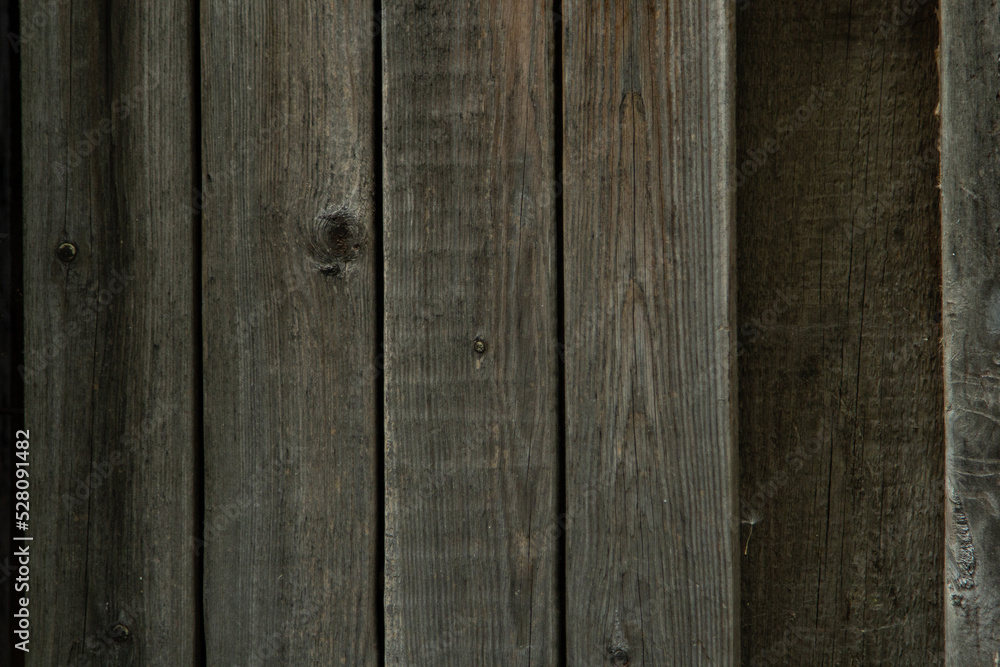 Fototapeta premium wooden gray boards, board pass in the fence, empty space, old tree