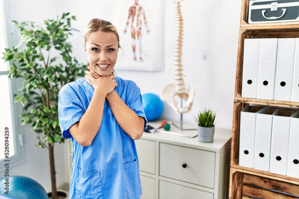 Young caucasian woman working at pain recovery clinic shouting and suffocate because painful strangle. health problem. asphyxiate and suicide concept. Young caucasian woman working at pain recovery clinic shouting and suffocate because painful strangle. health problem. asphyxiate and suicide concept.
