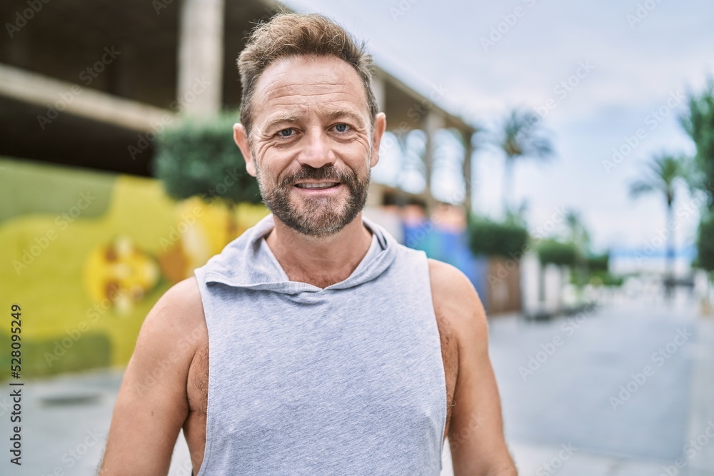 Middle age man smiling confident at the city Middle age man smiling confident at the city