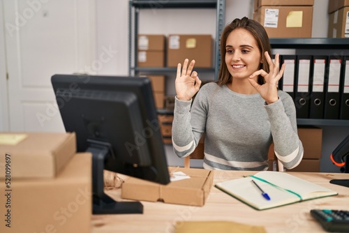 Young blonde woman ecommerce business worker having online deaf language conversation at office