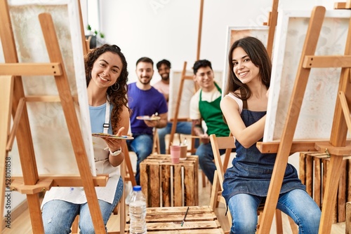 Group of draw students smiling happy drawing at art studio.