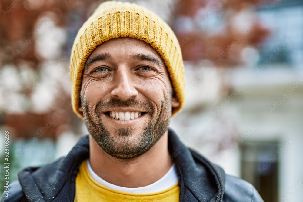 Handsome hispanic man with beard smiling happy outdoors Handsome hispanic man with beard smiling happy outdoors