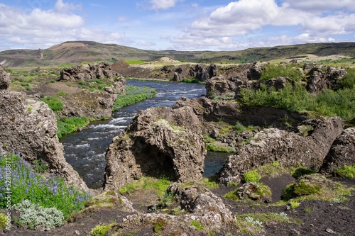 Top part of Hjalparfoss waterfall and basalt rocks in Iceland