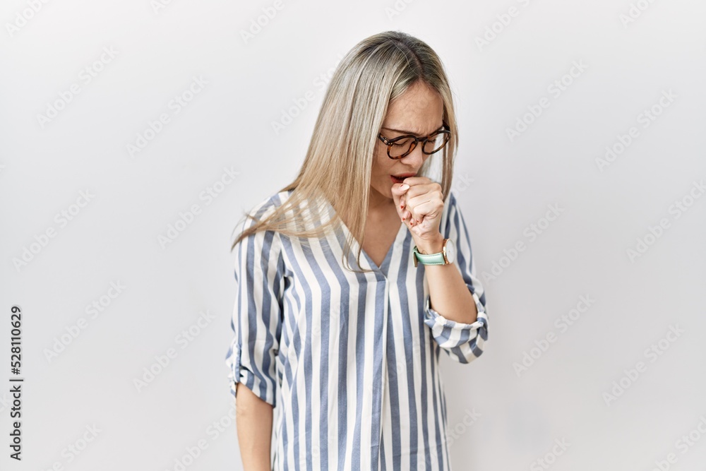 Asian young woman wearing casual clothes and glasses feeling unwell and coughing as symptom for cold or bronchitis. health care concept. Asian young woman wearing casual clothes and glasses feeling unwell and coughing as symptom for cold or bronchitis. health care concept.