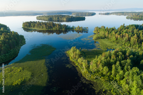 Overview of lake landscape in Northern Finland on a summer morning	