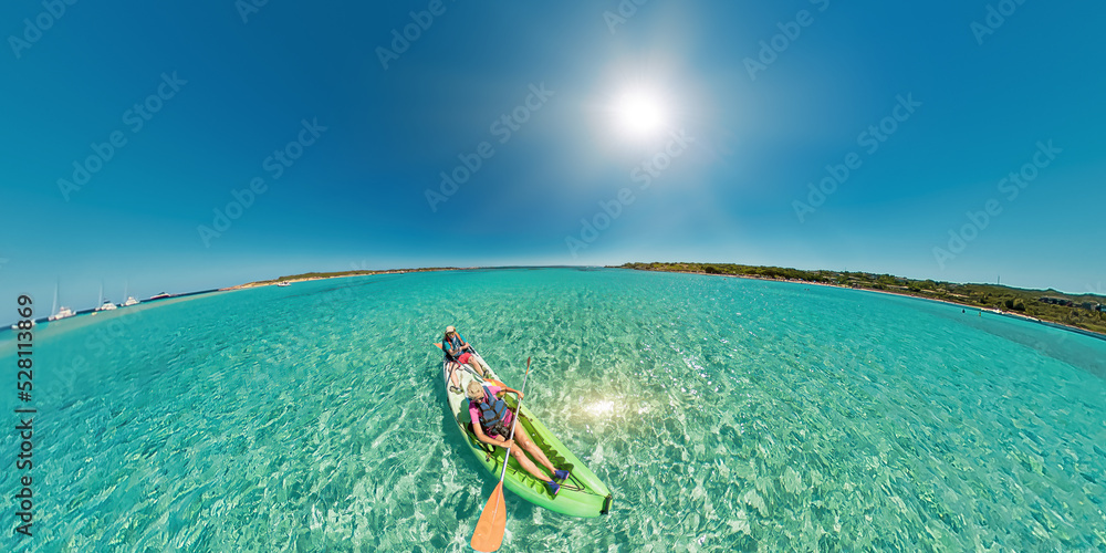 Aerial view kayak in the beach reef of Piana island, close to the Bonifacio town in Corsica of France. Drone view of people kayaking in the Mediterranean sea by Piana island.