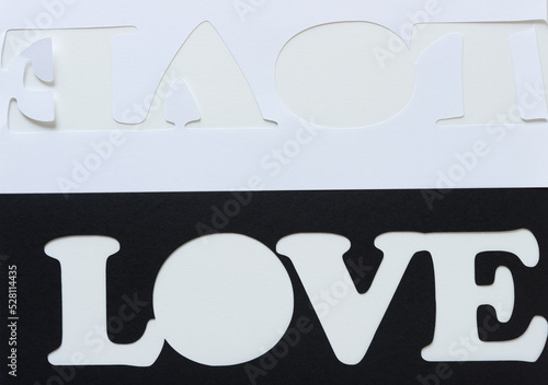 the word love represented with paper (black and white stencils) photo