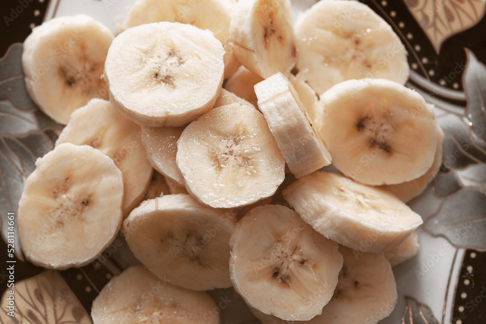 Chopped bananas in plate . Healthy exotic fruit Chopped bananas in plate . Healthy exotic fruit