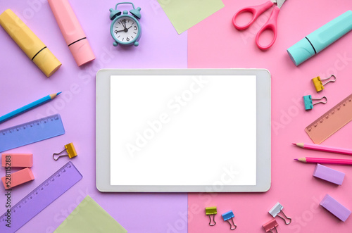 Digital tablet mock up template screen isolated on school stationery supplies pink pastel lavender trendy background flat lay. Online education, e learning apps, remote classes applications. Mockup