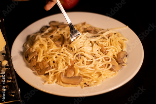fork holding cream cheese spaghetti