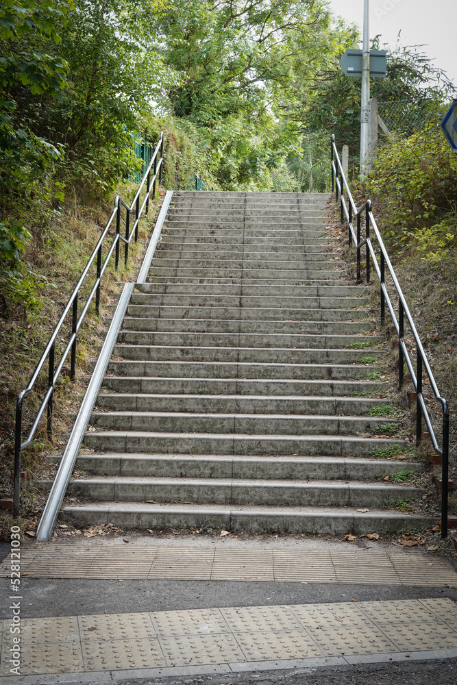 Concrete steps, stairs, with metal track or ramp for bicycles Concrete steps, stairs, with metal track or ramp for bicycles