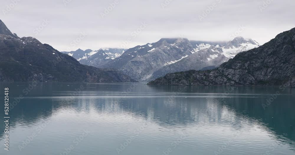 Glacier Bay ocean and mountains. Glacier Bay National Park and Preserve is an American national park. Alaska near Canada. Protected tourism destination accessible boat by sea. Glacier Bay ocean and mountains. Glacier Bay National Park and Preserve is an American national park. Alaska near Canada. Protected tourism destination accessible boat by sea.