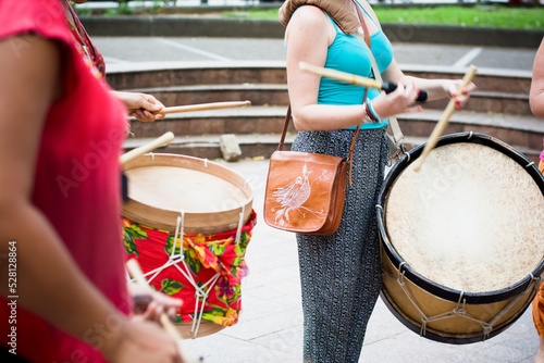 Woman playing Maracatu drums, a musical rhythm of cultural feasts typical of northeastern Brazil. photo