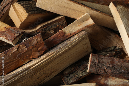 Cut firewood as background, closeup. Heating in winter