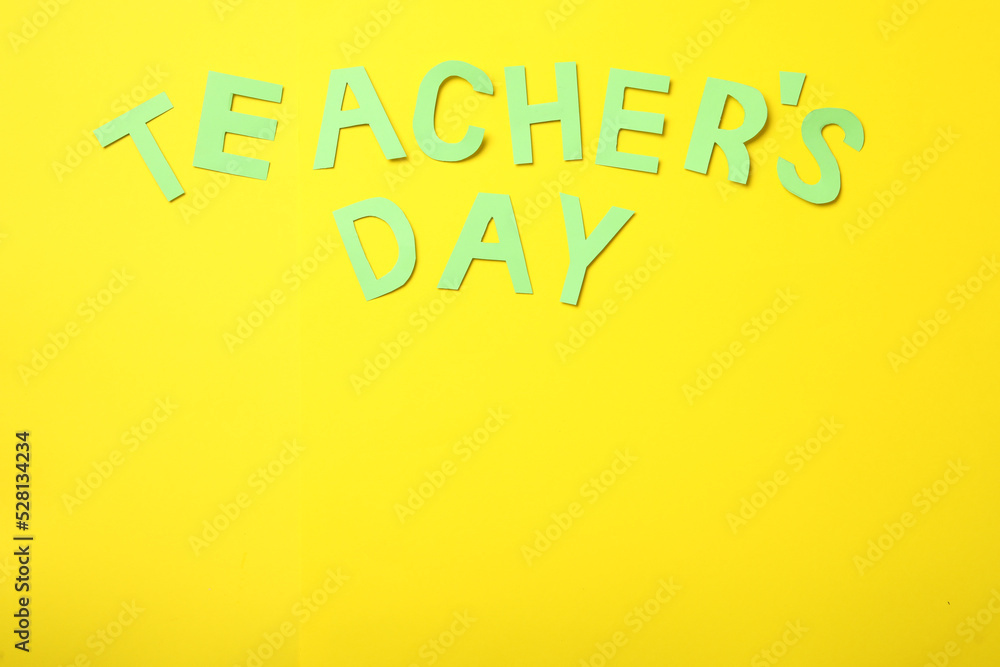 Words TEACHER'S DAY on yellow background, flat lay. Space for text