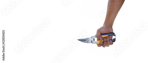 Hand holding yellow black aviation straight cut tin snip isolated white background with copy space