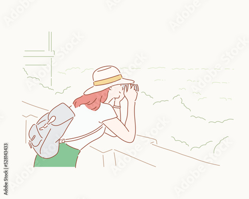 Girl photographing the mountains. Hand drawn style vector design illustrations.