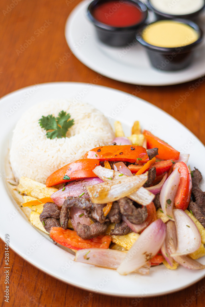 lomo saltado, with vegetables, served with rice
lomo saltado, with vegetables, served with rice