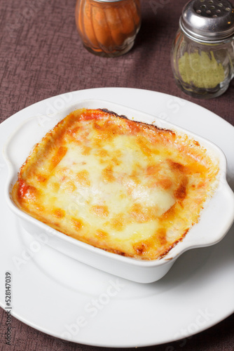Traditional italian lasagna with vegetables, minced meat and cheese.  - Imagen