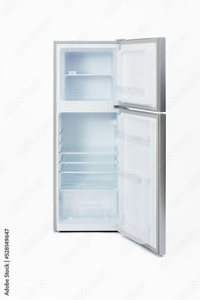 Brand new empty silver refrigerator with open door isolated on white background. Brand new empty silver refrigerator with open door isolated on white background.