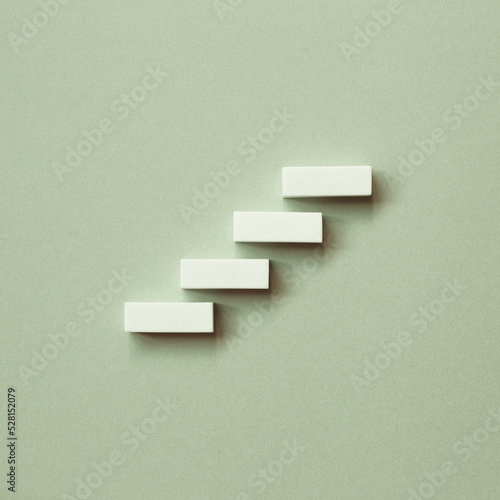 Abstract stairs or steps concept on green background
