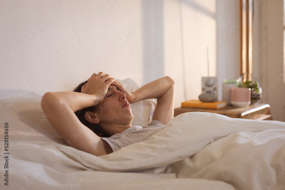 Obraz premium Sick Caucasian woman self isolating and social distancing in quarantine lockdown during coronavirus 