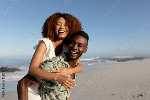 Happy couple spending time together on the beach