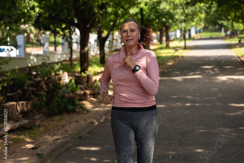 Female jogger running in the park