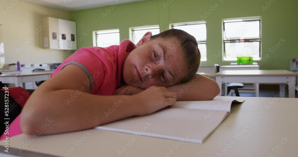 Girl with his head on desk in the class Girl with his head on desk in the class