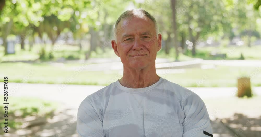 Senior man smiling in the park Senior man smiling in the park