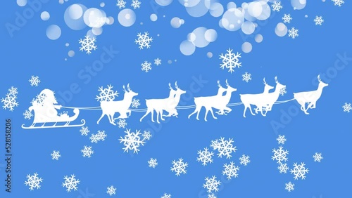 Animation of winter scenery with snowflakes falling and santa claus in sleigh being pulled by reinde photo