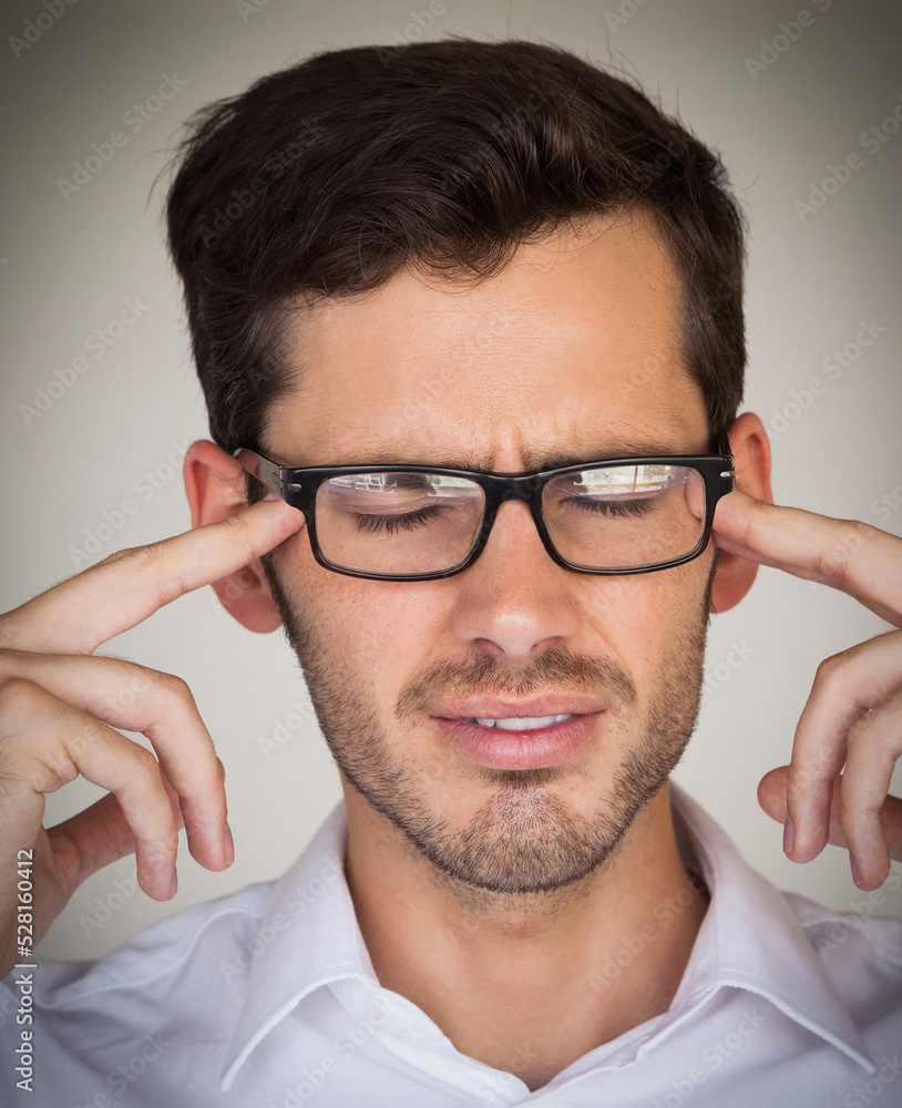 Casual businessman getting headache Casual businessman getting headache