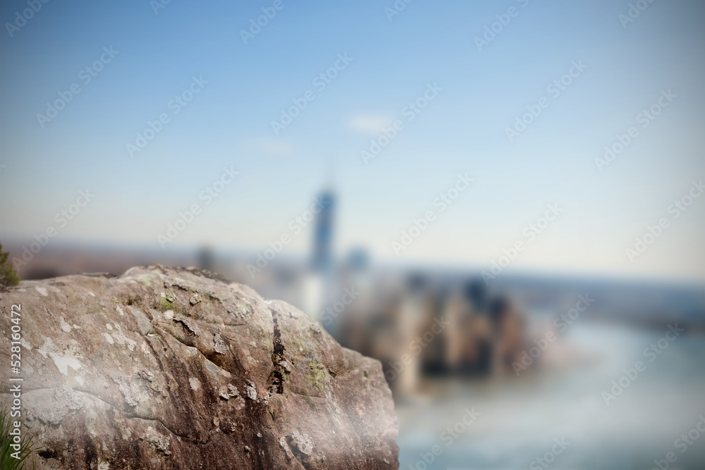 Fototapeta premium Large rock overlooking foggy city