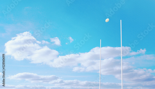 Rugby ball flying between posts