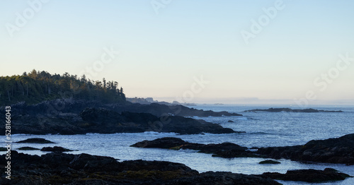 Rugged Rocks on a rocky shore on the West Coast of Pacific Ocean. Summer sunrise. Ucluelet, Vancouver Island, British Columbia, Canada. Nature Background