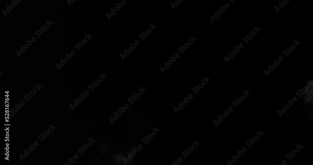 A jet of white smoke, steam, fog or gas on a black background. A jet of white smoke, steam, fog or gas on a black background.