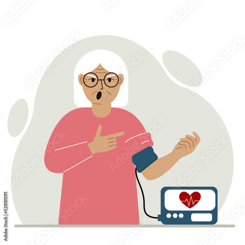 Old woman checks blood pressure. healthcare concept. Blood pressure measurement, digital tonometer. Health monitoring.