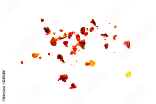 Dried chili flakes and seeds isolated on white background, top view. Red pepper isolated on white background, top view. Pieces of red pepper isolated on white background, top view.