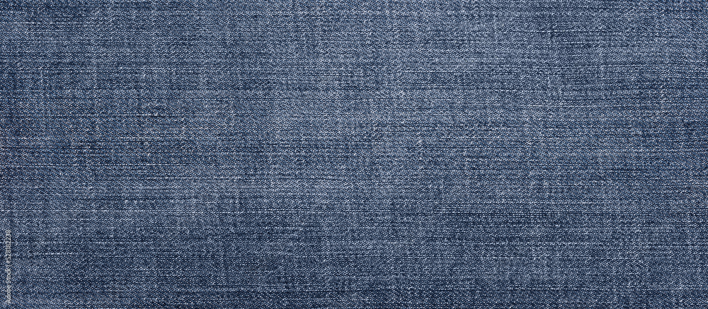Texture of denim close-up. Wide banner format. Background, blank for design. Texture of denim close-up. Wide banner format. Background, blank for design.