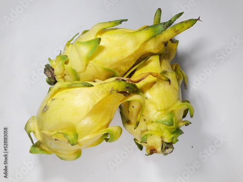 Dragon Fruit or Yellow Dragon Fruit - Selenicereus megalanthus. Isolated on white background. The thornless Huanglong variety is cultivated in Taiwan and is a rare variety. photo