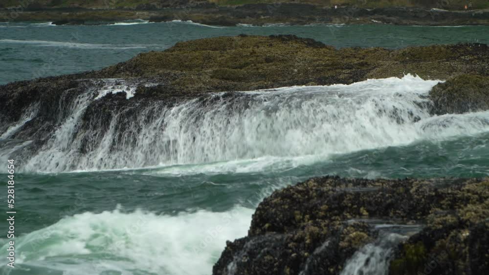 Waves crash against rocky shore on Oregon Coast. Waves crash against rocky shore on Oregon Coast.