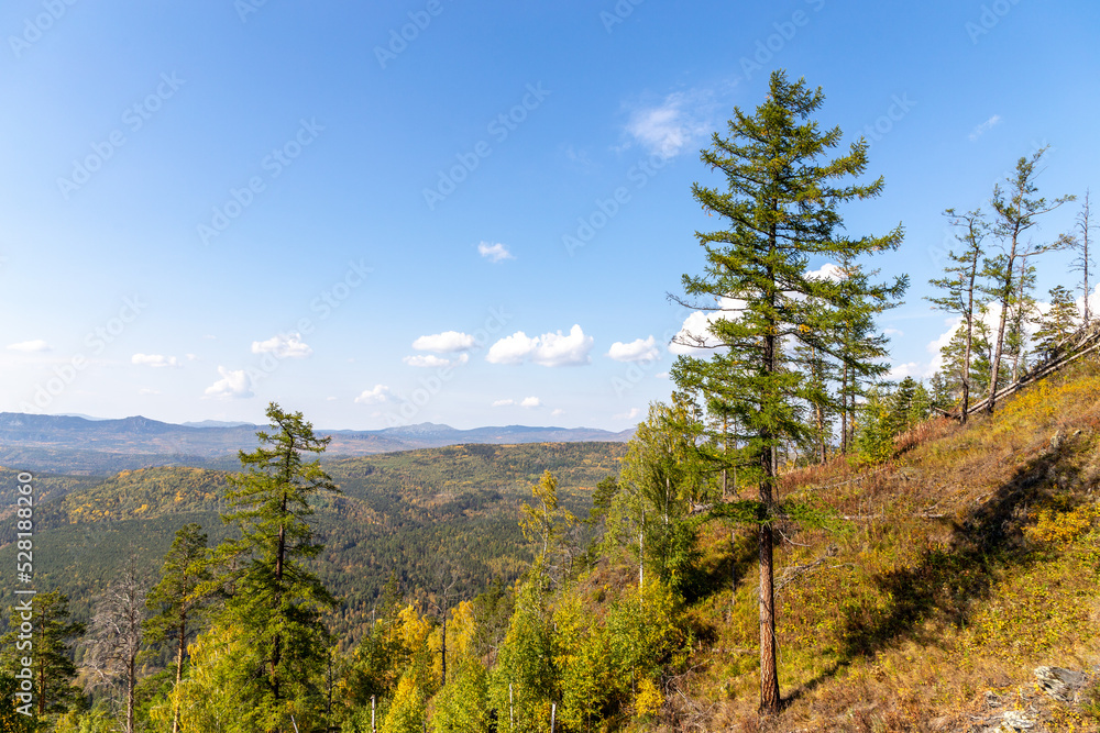 Beautiful view from the Sudovaya mountain to Inzer rocks, Yamantau mountain, Iremel mountain. Russia, South Ural, Bashkortostan Republic, Beloretsky district, near the Tirlyansky village.