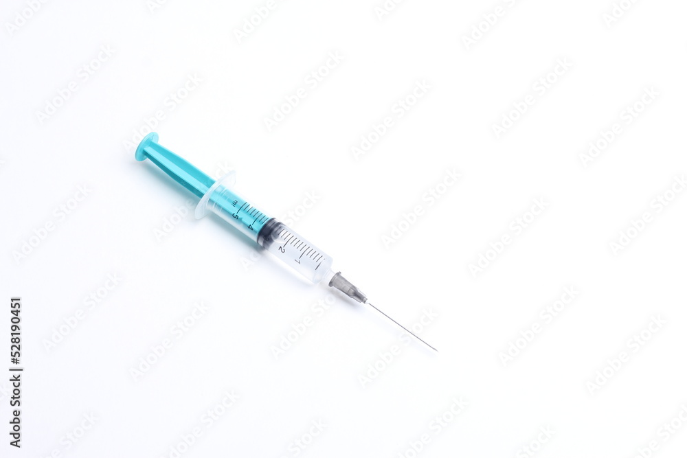 Medical syringe on a white background. A syringe for injection. The concept of health and beauty Medical syringe on a white background. A syringe for injection. The concept of health and beauty