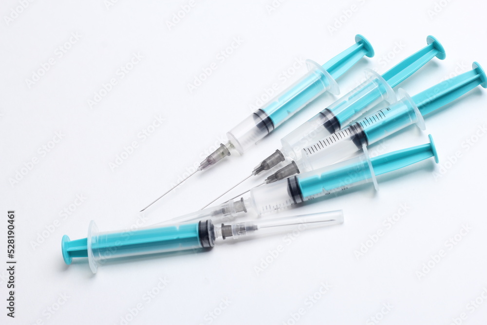 Medical syringe on a white background. A syringe for injection. The concept of health and beauty Medical syringe on a white background. A syringe for injection. The concept of health and beauty