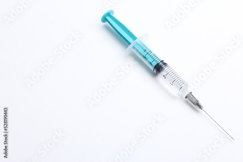 Medical syringe on a white background. A syringe for injection. The concept of health and beauty