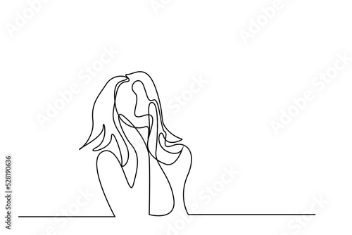 a woman puts her hands to face looking scared and worried